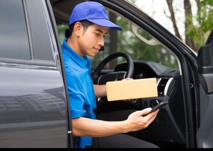 A field sales rep taking an order at a shop counter